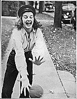 H0015-1. Betty Bloomer catches a ball at an Ottawa Beach, MI, house party. 1934.