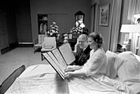 President and Mrs. Ford read a petition, signed by all 100 members of the United States Senate, in the President's Suite at Bethesda Naval Hospital, Bethesda, MD