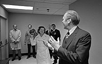 President Gerald Ford and Betty Ford toss a football, a gift from Washington Redskins Coach George Allen, in the hallway near the Presidential Suite at the Bethesda Naval Hospital, Bethesda, MD