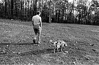 President Ford and his dog Liberty walk the grounds of Camp David