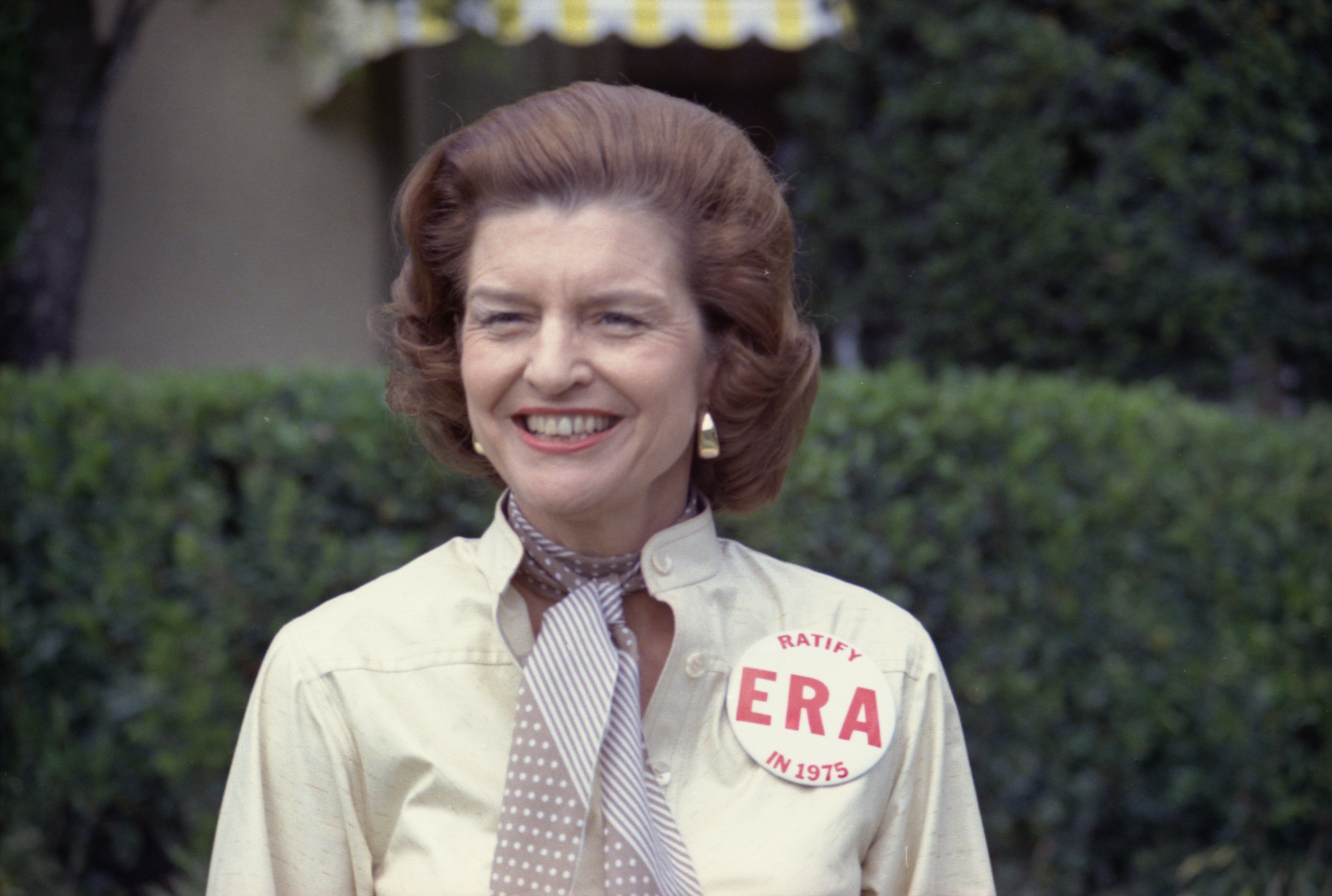 First Lady Betty Ford sports a button expressing her support for ratification of the Equal Rights Amendment while taking some personal time as President Ford plays in the Jackie Gleason Inverrary Classic Celebrities Golf Tournament.  Inverrary Country Club, Hollywood, Florida.   February 26, 1975.  