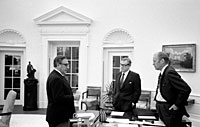 President Ford meets in the Oval Office with Secretary Kissinger and Vice President Rockefeller to discuss the American evacuation of Saigon