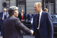 President Ford escorts Helmut Schmidt, Chancellor of the Federal Republic of Germany, to his limousine after a luncheon meeting at the American Embassy Residence.   Brussels, Belgium.  May 29, 1975.  