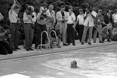 President Ford takes his first swim in the new White House swimming pool.   