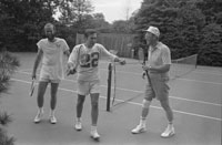 President Ford, Chief of Staff Donald Rumsfeld, and David Kennerly, Personal Photographer to the President, following a tennis match on the White House Tennis Courts.  (not shown Deputy Press Secretary Bill Greener, Jr.)   July 16, 1975.    