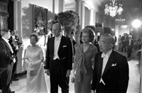 President and Mrs. Ford escort the Emperor (Hirohito, now Showa) and Empress of Japan to a white tie dinner held in honor of their first State Visit to the United States. October 2, 1975.  