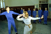 While touring the Central May 7th College of Art in Peking, People's Republic of China, First Lady Betty Ford shares a dance move with one of the students.