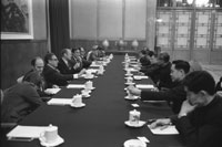 After bilateral talks Vice Premier Teng Hsiao-P’ing leads President Ford, Chief U.S. Liaison Officer George H.W. Bush and others through the Great Hall of the People. President Ford and staff hold bilateral talks with Vice-Premier Teng Hsiao-P’ing and other officials.