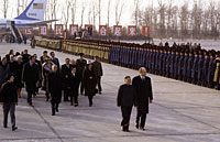Escorted by Deng Xiao Ping President Ford inspects the honor guard upon his arrival in China with his entourage, which included Mrs. Ford and Secretary of State Henry Kissinger. December 1, 1975. 