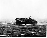 The USS Monterey founders during a typhoon in December 1944