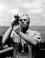 Navigation Officer Gerald R. Ford takes a sextant reading aboard the USS Monterey