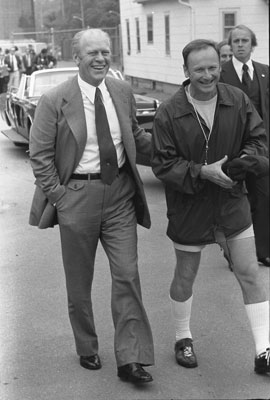 President Ford and University of Michigan football coach Bo Schembechler walk toward the University of Michigan practice field during a visit to the campus to Kick-Off his 1976 Presidential Campaign.  