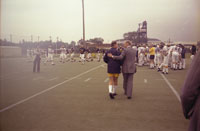 President Ford greets coach Bo Schembechler before heading for the practice field  in Ann Arbor.  September 15, 1976.