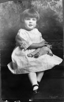 Elizabeth Ann "Betty" Bloomer, age 3, with her teddy bear. April 1921. 