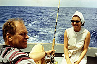 Gerald R. Ford and Betty Ford talk while Mr. Ford tries some deep-sea fishing during a vacation trip to Free Town, Eleutheria, Bahamas, with other Republican Congressmen and their wives. April 1966.