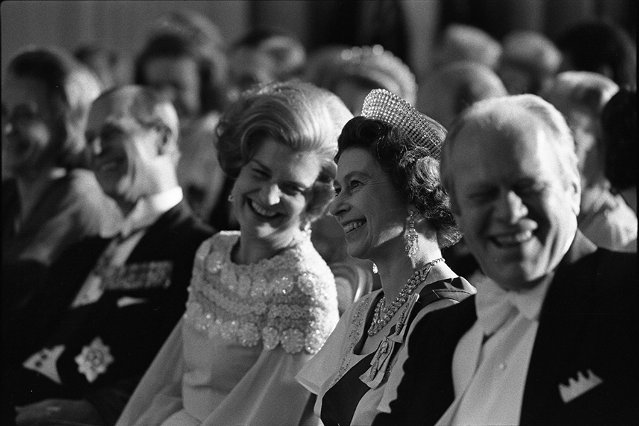 Prince Philip, Betty Ford, Queen Elizabeth II, and President Ford watch a performance during the entertainment portion of the state dinner honoring Her Majesty.