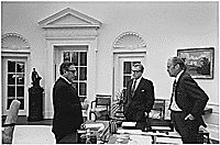 A4241-30A. President Ford meets in the Oval Office with Secretary of State Henry Kissinger and Vice President Nelson A. Rockefeller to discuss the American evacuation of Saigon, April 28, 1975.