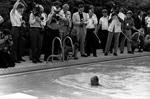 President Ford swimming in front of the press