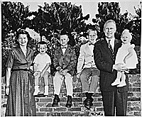 H0008-3. The Ford family poses in the back yard of their home at 514 Crown View Drive, Alexandria, VA. 1959. 