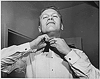 H0012-3. Gerald R. Ford, Jr., ties a bow tie. 1961.