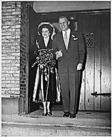 H0013-3. Gerald R. Ford, Jr., and Betty Ford pose on the steps of Grace Episcopal Church in Grand Rapids, MI, following their marriage. October 15, 1948.