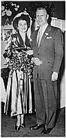 H0013-4. Gerald R. Ford, Jr., and Betty Ford pose in front of the ambo in Grace Episcopal Church in Grand Rapids, MI, following their marriage. October 15, 1948. 