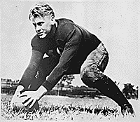 H0014-1 and H0035-3 (H0035-3 provides better reproduction). Gerald R. Ford, Jr. centers a football during practice at the University of Michigan, Ann Arbor, MI. 1933. 