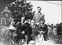 H0019-4. Gerald R. Ford, Jr. is flanked by half-brothers Richard A. Ford, and James F. Ford, while Thomas G. Ford stands behind him for a family portrait. 1938.