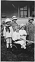 H0021-2. Gerald R. Ford, Jr. (then known as Leslie Lynch King, Jr.) poses with his cousins Gardner and Adele James and two unidentified girls. 1915.
