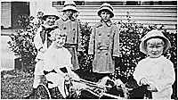 H0021-4. Gerald R. Ford, Jr. (then known as Leslie Lynch King, Jr.) poses with his cousins Gardner and Adele James and two unidentified girls. 1915.