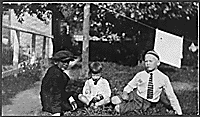 H0025-1. Gerald R. Ford, Jr. sits on the lawn with Tom Ford and an unidentified boy. 1923.