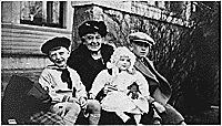 H0027-1 and H0027-2. Gerald R. Ford, Jr. with his half-brothers Tom and Dick Ford and his maternal grandmother Adele Ayer Gardner on the front steps of the Ford home at 649 Union Street, SE, Grand Rapids, MI. 1925.