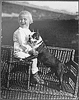 H0027-3. Gerald R. Ford, Jr. poses with his pet Boston Terrier. 1916.