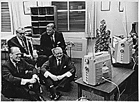 H0036-2. Representative Gerald R. Ford, Senator Everett M. Dirksen, Ray Bliss and Thruston Morton watch election returns on several televisions in an unidentified office. November 8, 1966.
