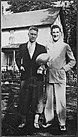 H0037-2. Gerald R. Ford, Jr. holds the trophy he received at the best freshman in spring practice while standing with University of Michigan football teammate Herman Everhardus. 1932. 