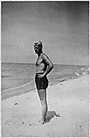 H0037-3. Gerald R. Ford, Jr. stands on the shore at Ottawa Beach, MI, site of his parent's summer cottage. 1940.
