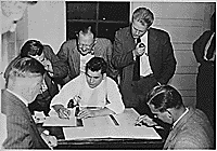 H0038-4. Gerald R. Ford, Jr., watches as Joe Zalewski, Thorne Brown, and other campaign aides tally votes during the Fifth District Republican Primary Election. September 15, 1948.