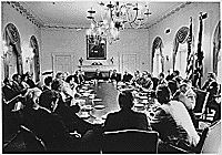 H0049-3. Flanked by House Minority Leader Gerald R. Ford, and Senate Minority Leader Hugh Scott, President Richard M. Nixon conducts a meeting with members of the Republican Congressional Leadership in the Cabinet Room. 1970. 