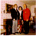 H0072-2. Mike Ford poses with his parents in front of the fireplace in the living room of the family residence at 514 Crown View Drive, Alexandria, VA. December 1972.