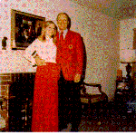 H0072-4. Susan Ford poses with Gerald R. Ford for a Christmas portrait in front of the fireplace in the living room of the family residence at 514 Crown View Drive, Alexandria, VA. December 1972.