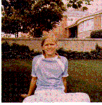 H0072-12. Susan Ford sits in a flower bed in the back yard of the family residence at 514 Crown View Drive, Alexandria, VA. June 1968.