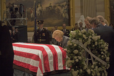 With her four children behind her Mrs. Ford pauses at the casket of her husband of forty-two years during the state funeral events for President Ford at the U.S. Capitol.  