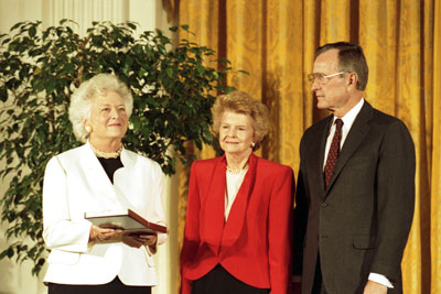 Former First Lady Betty Ford receives the Presidential Medal of Freedom from  President George H.W. Bush and First Lady Barbara Bush.