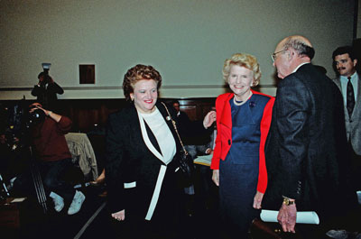 Congresswoman Mary Rose Oakar (D-OH) greets Betty Ford who arrives to testify before the Select Committee on Aging, Subcommittee on Health and Long-Term Care in support of public spending and insurance coverage for substance abuse treatment programs, such as those offered by the Betty Ford Center.  