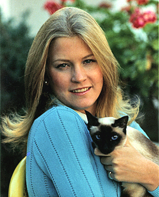 Susan Ford and her Siamese cat, Shan, pose for People Magazine