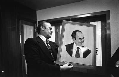 President Ford examines a wood portrait of himself given by Soviet General Secretary Leonid Brezhnev.  Okeansky Sanatorium.  
