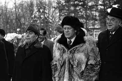 The two world leaders depart Okeansky Sanatorium after signing the joint communique on the limitation of strategic offensive arms.  November 24, 1974. (Also shown are Soviet Ambassador Anatoly Dobrynin and Chief of Staff Donald Rumsfeld).