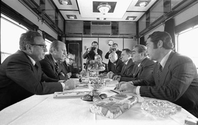 President Ford, Secretary of State Henry Kissinger and other United States representatives meet with General Secretary Brezhnev, Foreign Secretary Gromyko, Ambassador Dobrynin, and others aboard a Russian train headed for Vladivostok, USSR.   