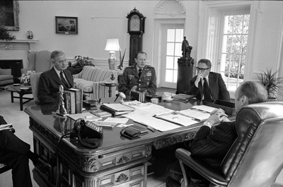 President Gerald R. Ford meets with Secretary of State Henry Kissinger, Army Chief of Staff General Frederick Weyand, and Graham Martin, Ambassador to Vietnam.