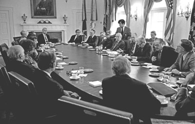 President Ford briefs the Republican Congressional Leadership on the situation in Indochina. Defense Secretary James Schlesinger and Secretary of State Henry Kissinger are seated at the far end of the table.  